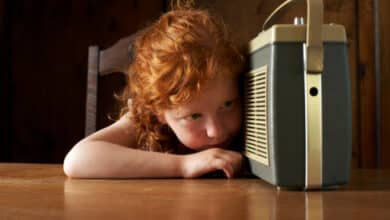 girl (4 6) listening to radio